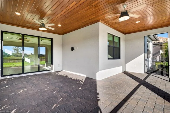 View of patio featuring ceiling fan