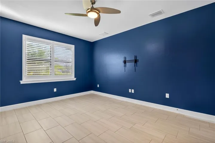 Bedroom with baseboards and a ceiling fan