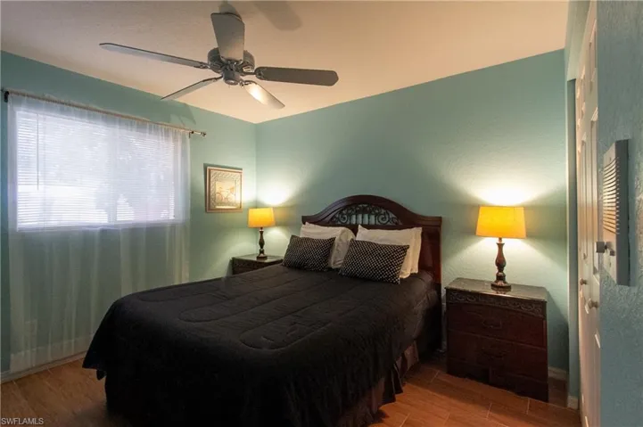 Bedroom featuring hardwood / wood-style floors and ceiling fan