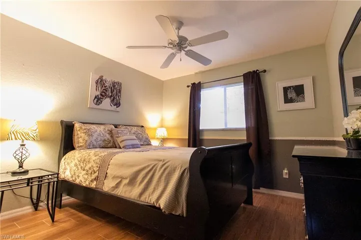 Bedroom with wood-type flooring and ceiling fan