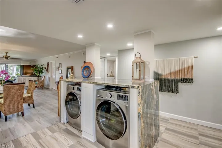 Washroom with washer and dryer and ceiling fan