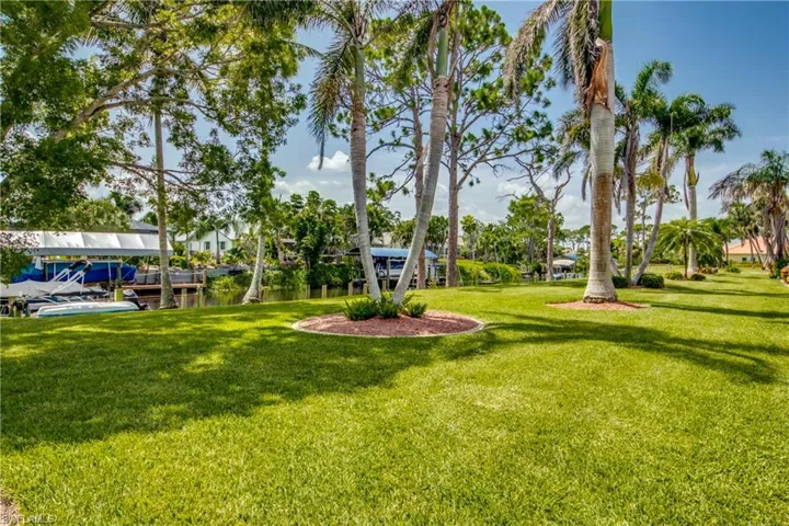 View of yard with a water view