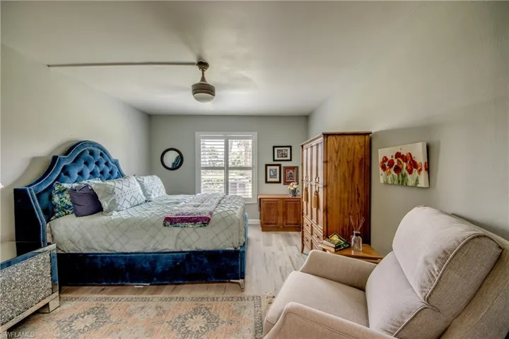 Bedroom featuring ceiling fan and light hardwood / wood-style floors