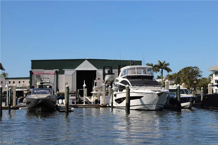 Slip 28 with large white yacht