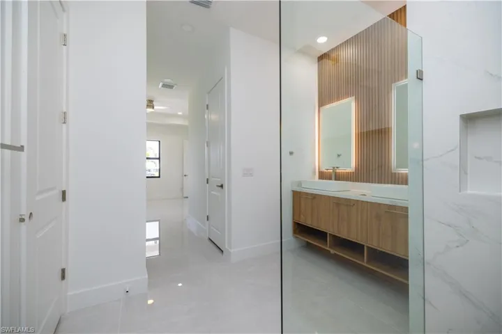 Bathroom featuring tile flooring and vanity
