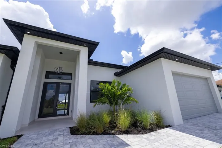 Entrance to property featuring a garage