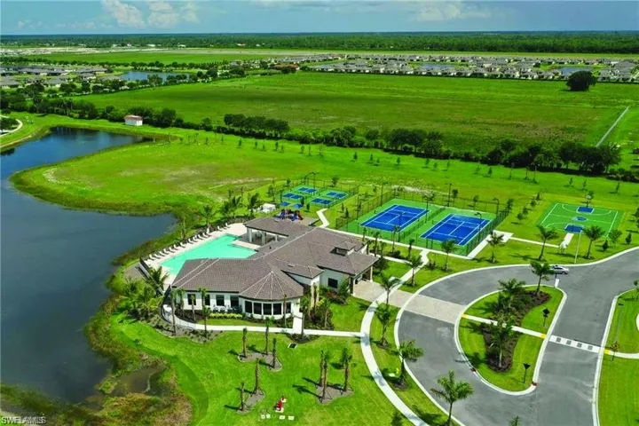 Expansive community amenities including a large swimming pool, clubhouse, tennis courts, and basketball court