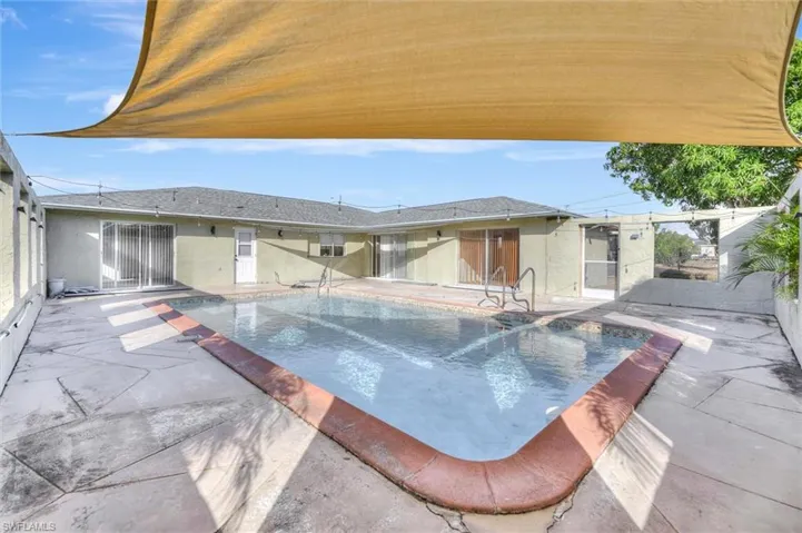 Outdoor pool with a patio