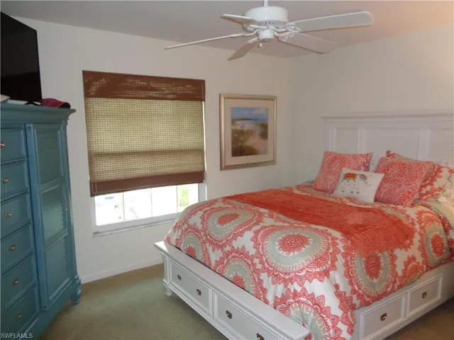 Bedroom featuring carpet and ceiling fan