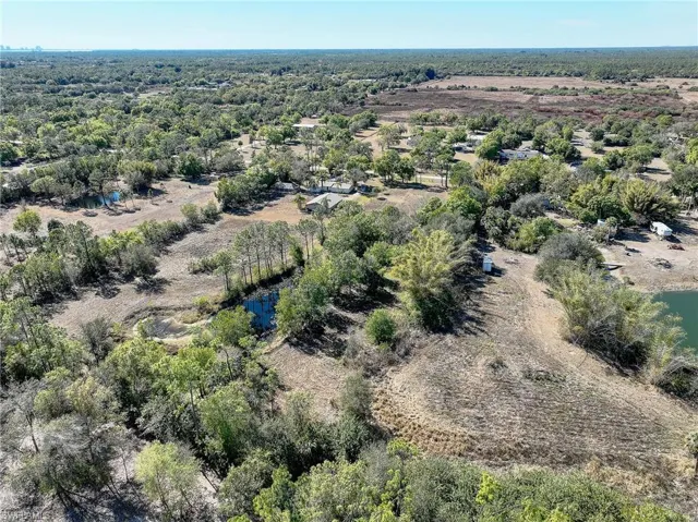 Aerial overview of property's location featuring a large body of water