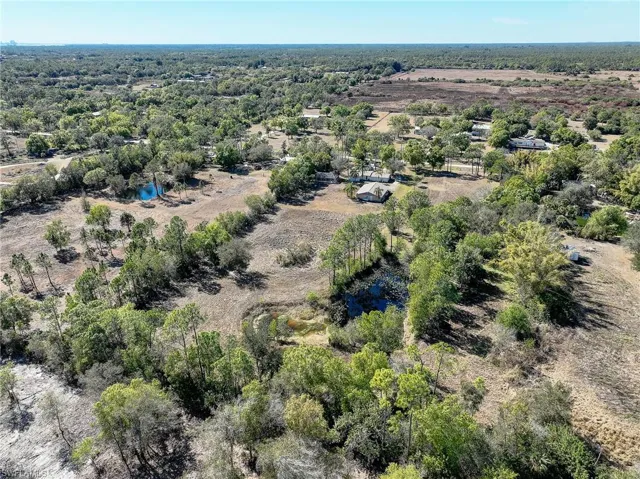 Aerial view of property's location featuring a large body of water