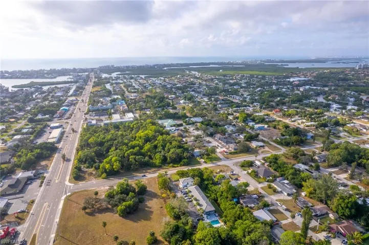 Aerial view West of property and surrounding area featuring Bonita Beach and Gulf