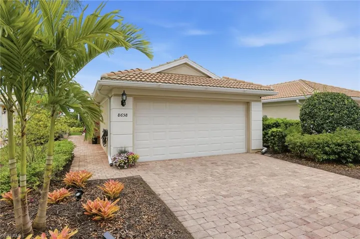 Attached 2-car Garage with pavers and side entrance