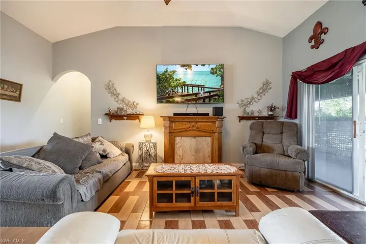 Living room featuring vaulted ceiling