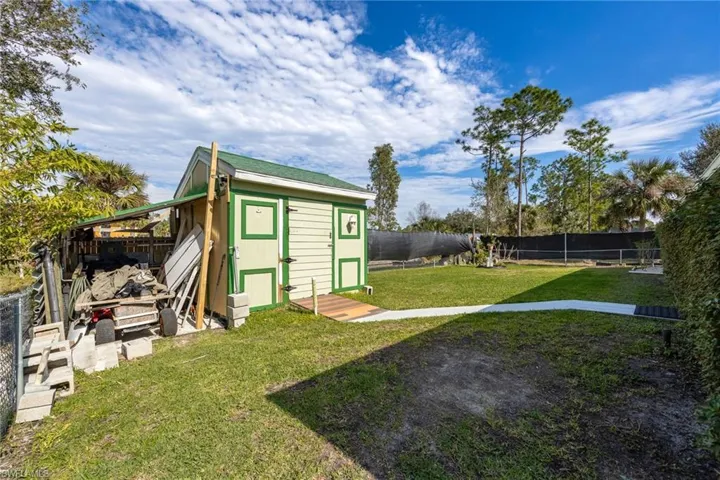 Fenced Yard with a storage shed