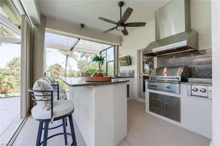 Fridge drawers to the left, ice maker. H/C sink, high-end grilling station with exhaust vent