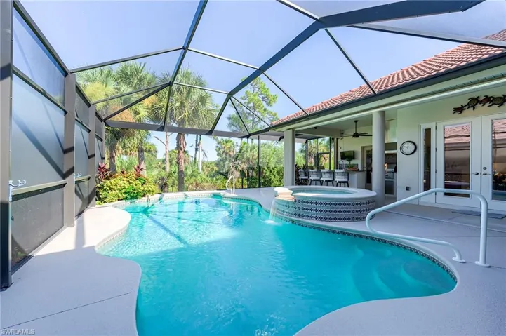 Fabulous outdoor kitchen.  Pool bath door to left of grill