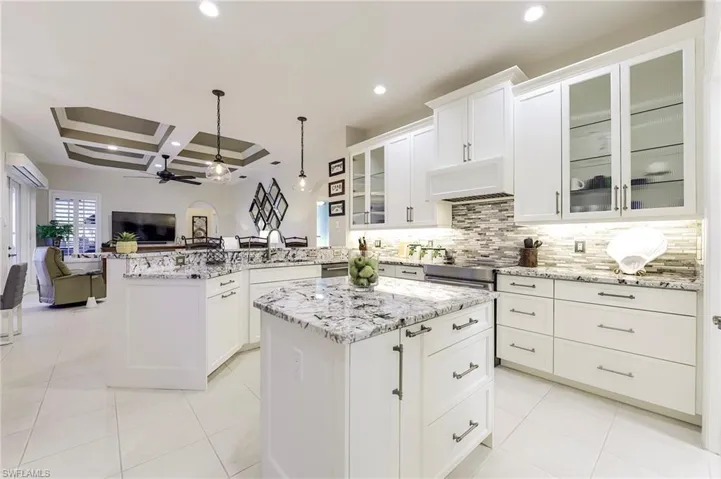 Formal dining area with access from kitchen and kitchen bar