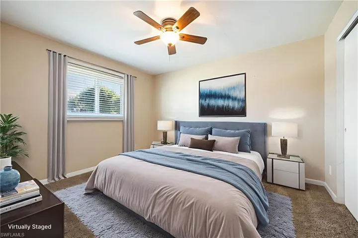 VIRTUALLY STAGED Bedroom featuring carpet floors and ceiling fan