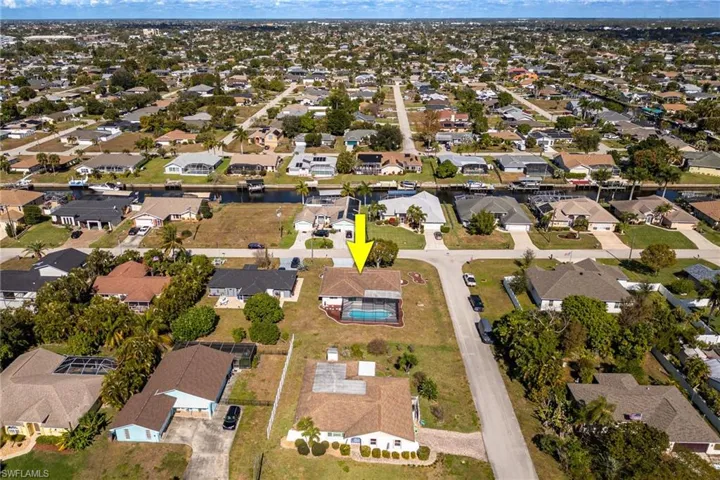 View of property location with nearby suburban area