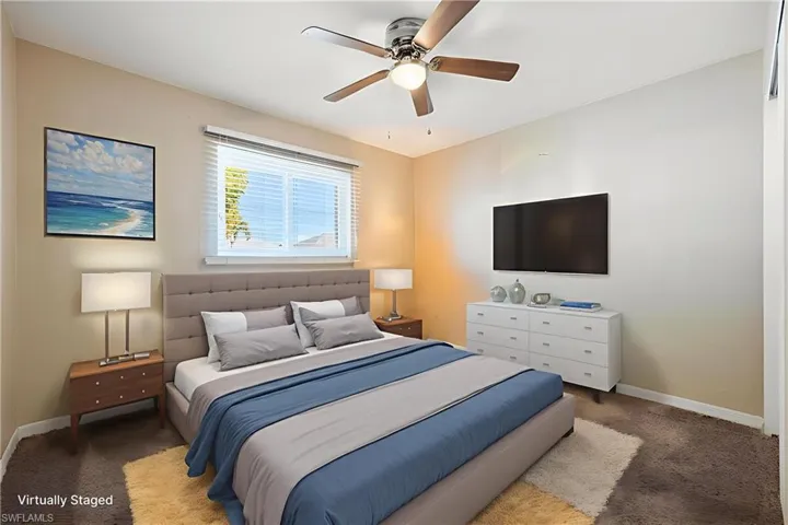 REMOVED ITEMS AND VURTUALLY STATED Carpeted bedroom featuring baseboards and ceiling fan