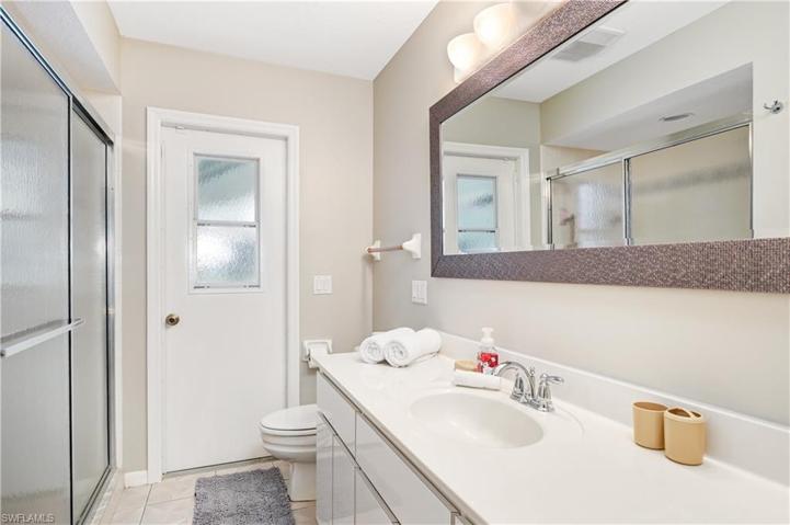 bathroom #2 is located between the guest rooms and also leads to pool