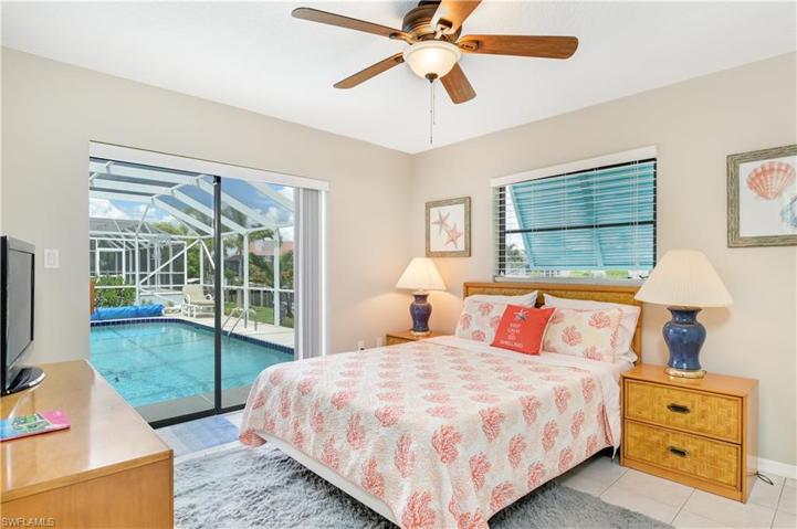 bedroom #3 with sliders leading to the pool and large closet