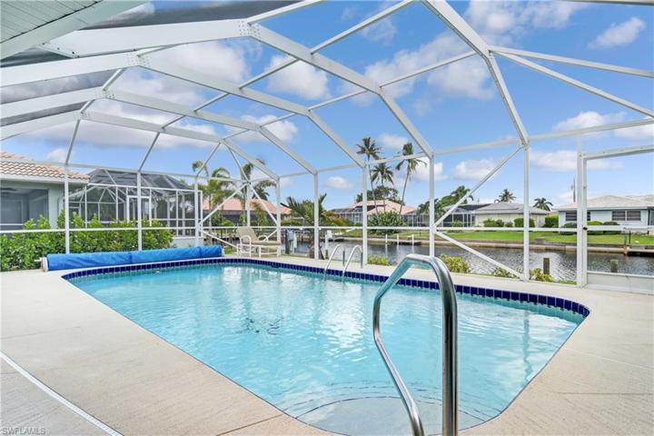 relax in the pool while taking in views of the canal and boats