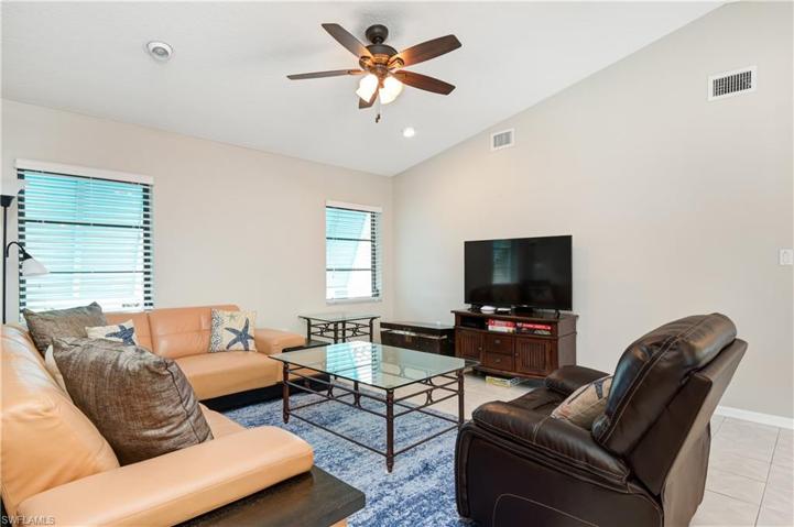 second living area with plenty of seating and television