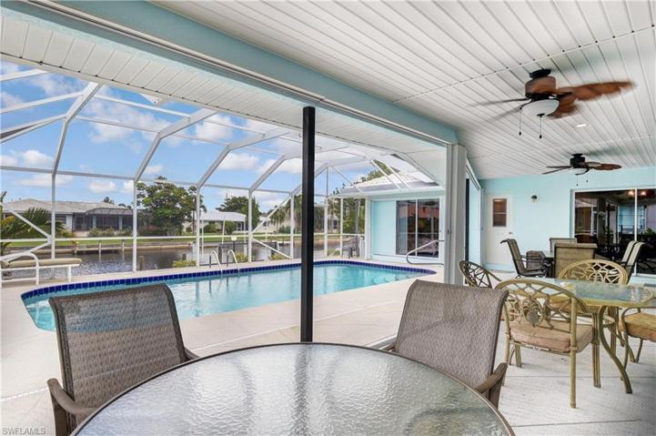 Outside space has plenty of room for entertaining poolside