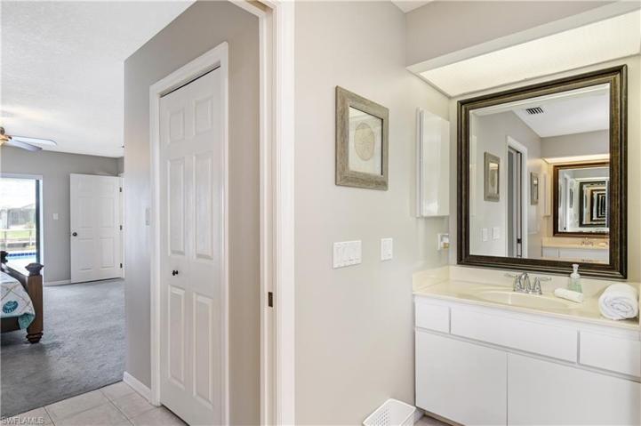 double vanities in the primary bedroom with two walk-in closets