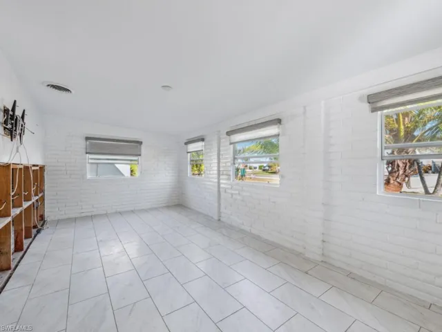 Unfurnished room with brick wall
