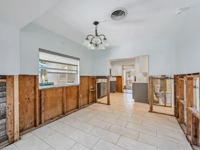 Kitchen with decorative light fixtures and an inviting chandelier