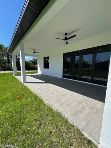 View of patio featuring ceiling fan and french doors