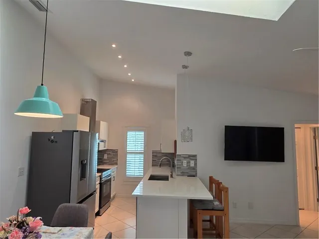 Galley style and bar.