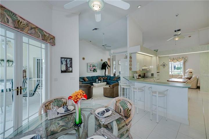 eat in kitchen area looking into the kitchen and family room and lanai