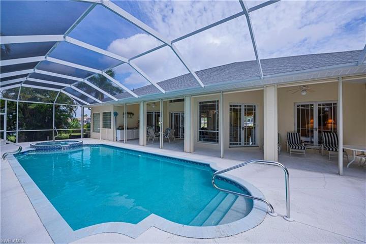 Pool and spa looking into the home and the covered lanai area