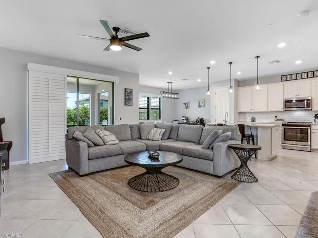 Tiled living room with ceiling fan