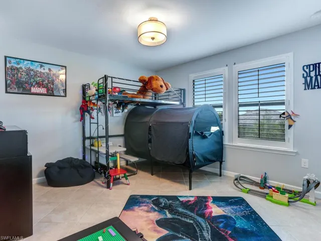 Bedroom with light tile patterned floors