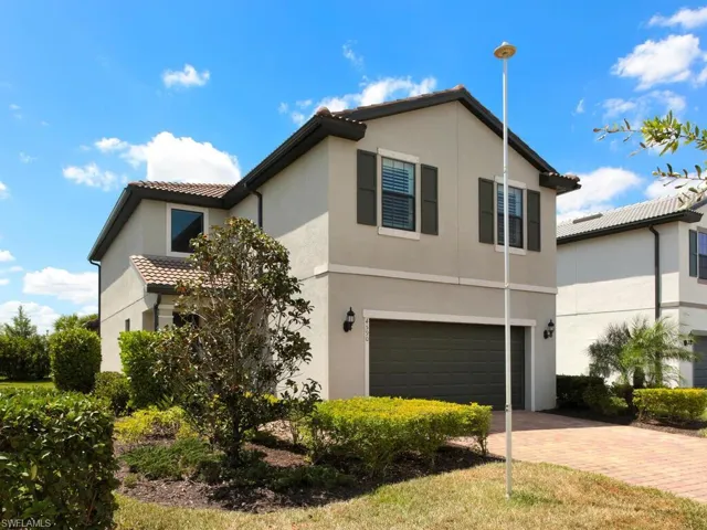 View of front of property with a garage