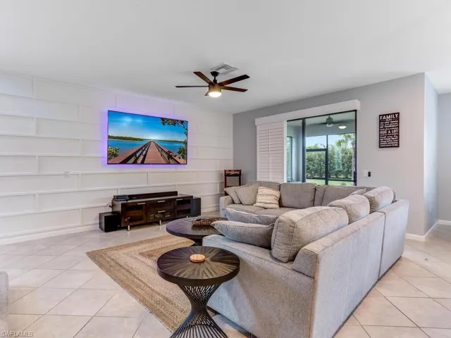 Tiled living room with ceiling fan