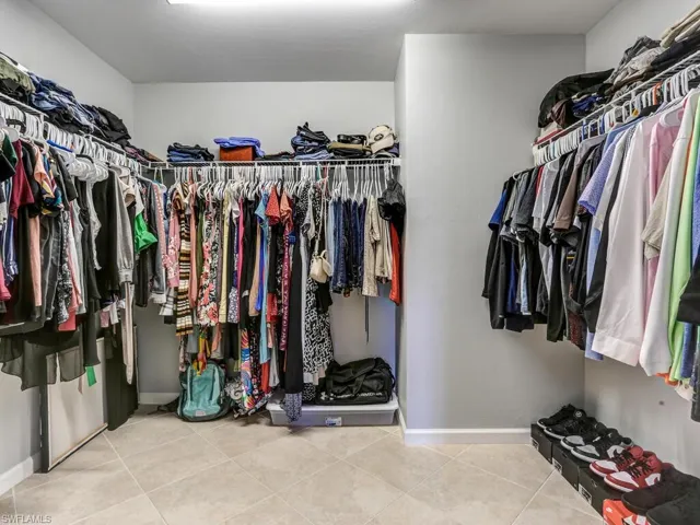 Spacious closet featuring light tile patterned floors