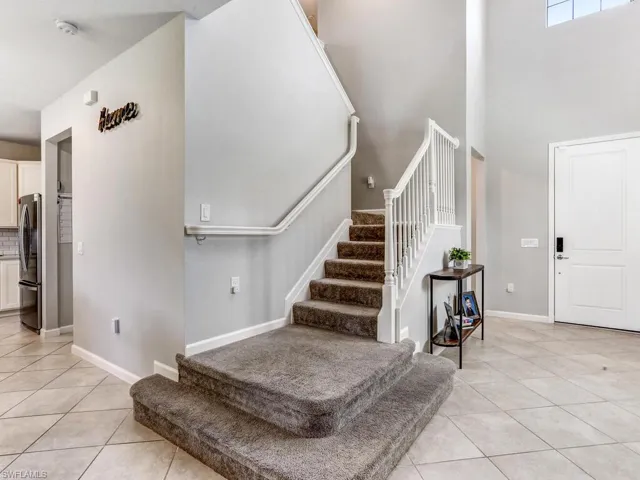 Entrance foyer featuring light tile patterned flooring