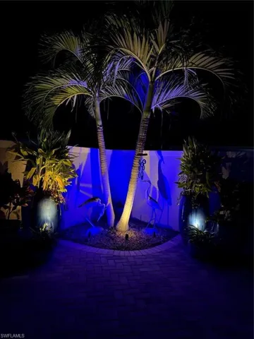 Custom landscape lighting in courtyard