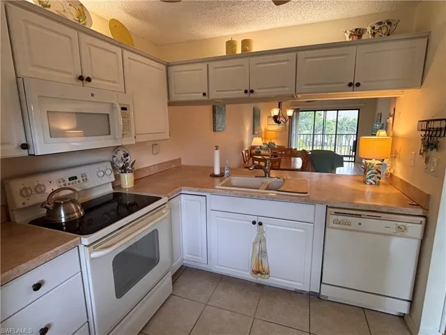 Kitchen with pass through to Dining and Living area