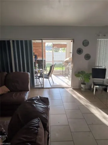 Living room with tile flooring