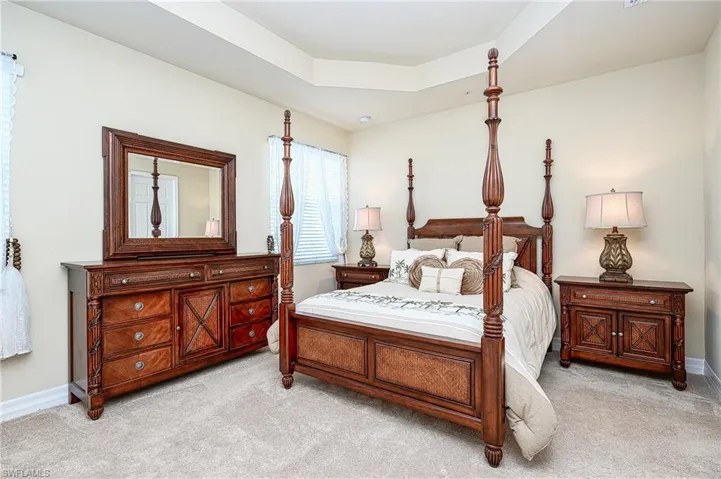Main bedroom suite with tray ceiling, private bathroom and large walk-in closet