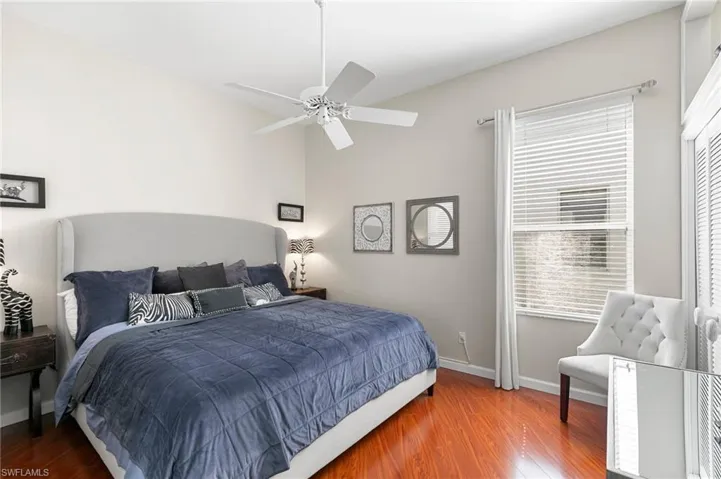 Bedroom featuring ceiling fan and hardwood / wood-style floors