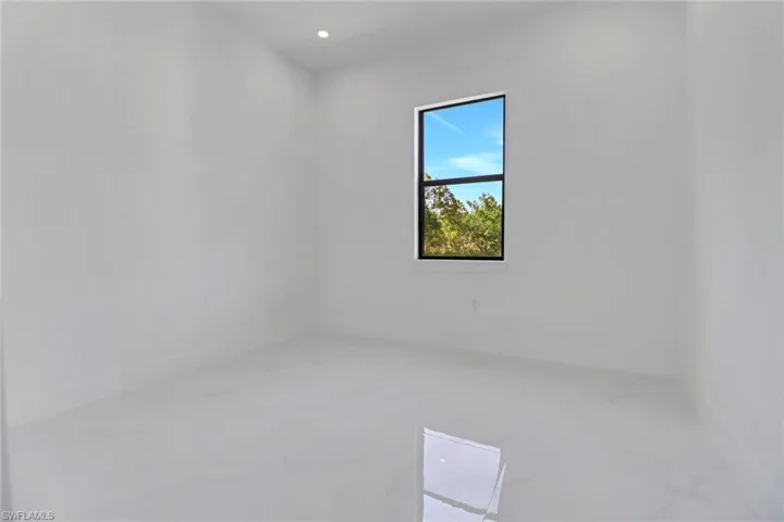Spare room with recessed lighting and marble finish floor