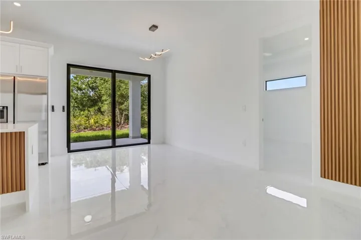 Unfurnished dining area with marble finish floor